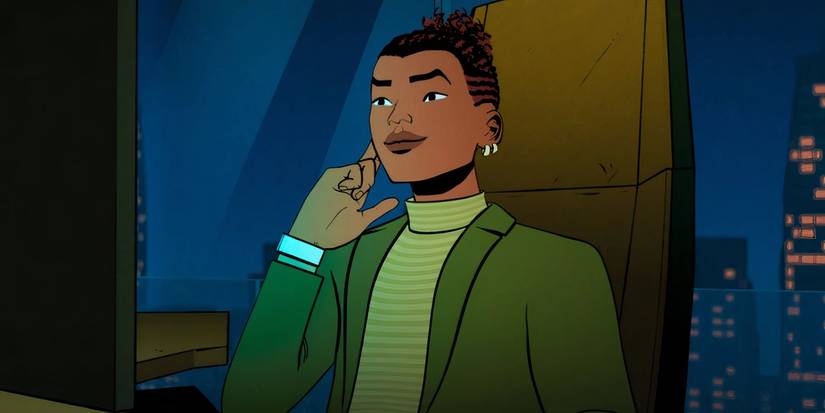 Harry Osborn sitting at a desk touching his earpiece in Your Friendly Neighborhood Spider-Man