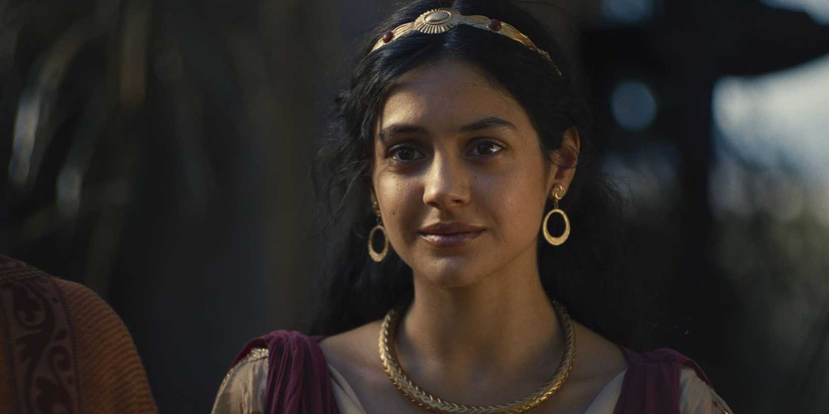 Indy Lewis as Mychal looking ahead and smiling slightly in House of David