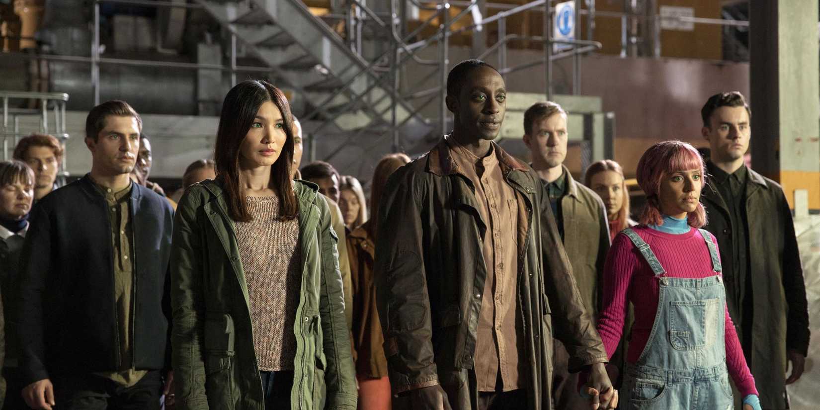 Mia standing in a line with other robots on Humans.