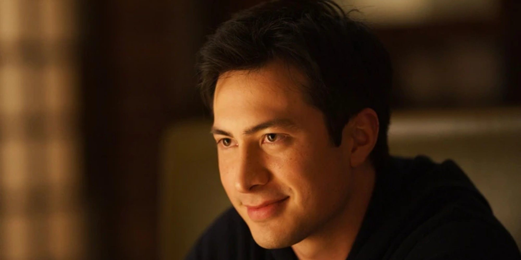 Hudson Williams as Shane Hollander smiling in Heated Rivalry
