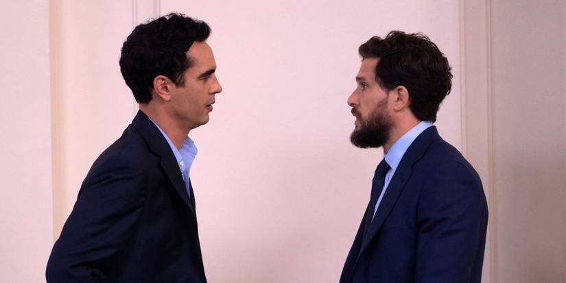 Max Minghella as Whitney standing across from Kit Harington as Henry while they talk in Industry Season 4
