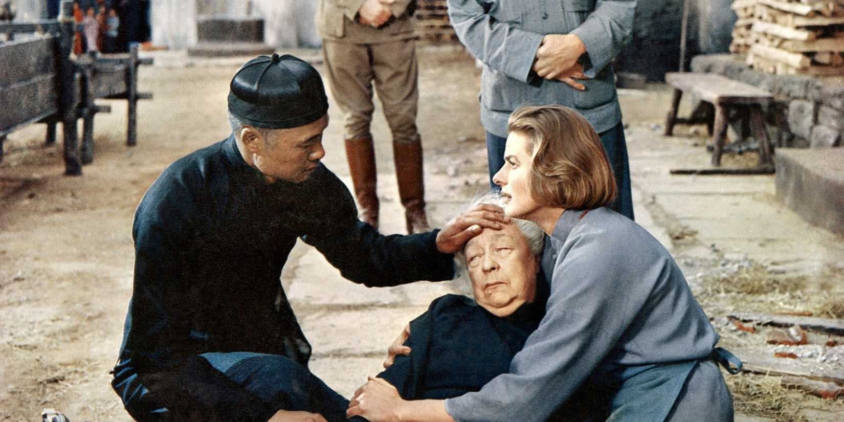 Ingrid Bergman holding a woman in 'The Inn of the Sixth Happiness'
