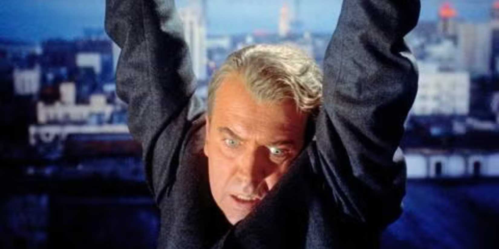 John Ferguson (James Stewart) seen hanging from a ledge in Vertigo.