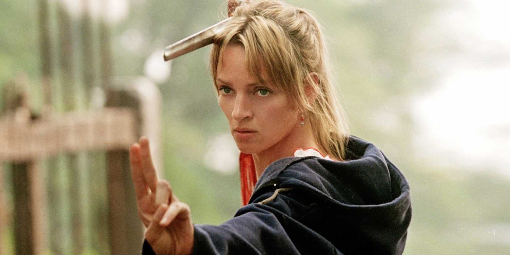 Uma Thurman as the Bride / Beatrix Kiddo posing with a samurai sword in Kill Bill: Volume 2 (2004)