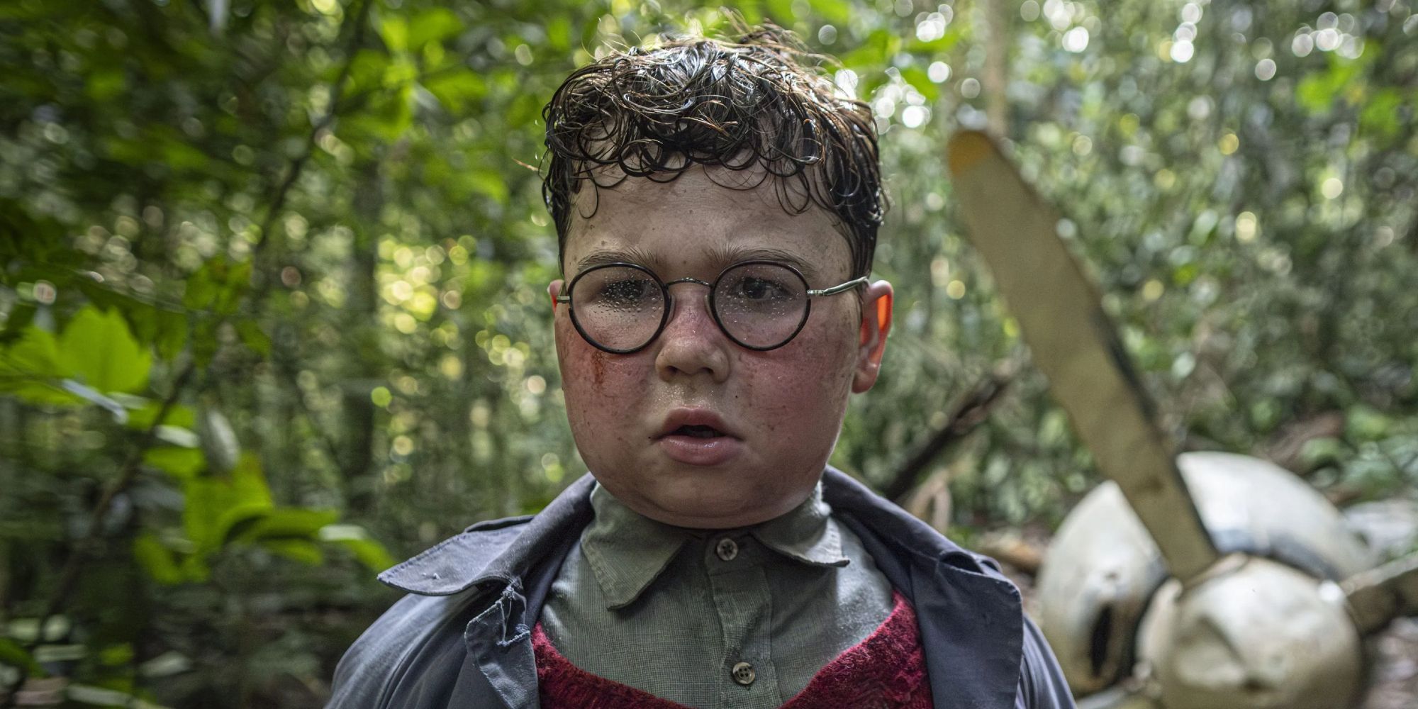 David McKenna standing in front of a downed plane in Lord of the Flies