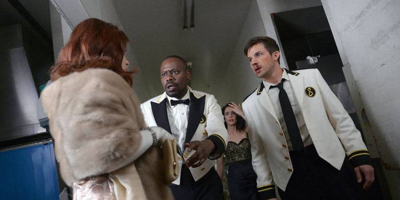 Malcolm Barrett and Matt Lanter with a bloody nose look baffled at Abigail Spencer in Timeless