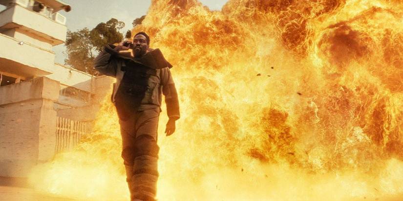 Yahya Abdul-Mateen II with an explosion behind him in Man on Fire