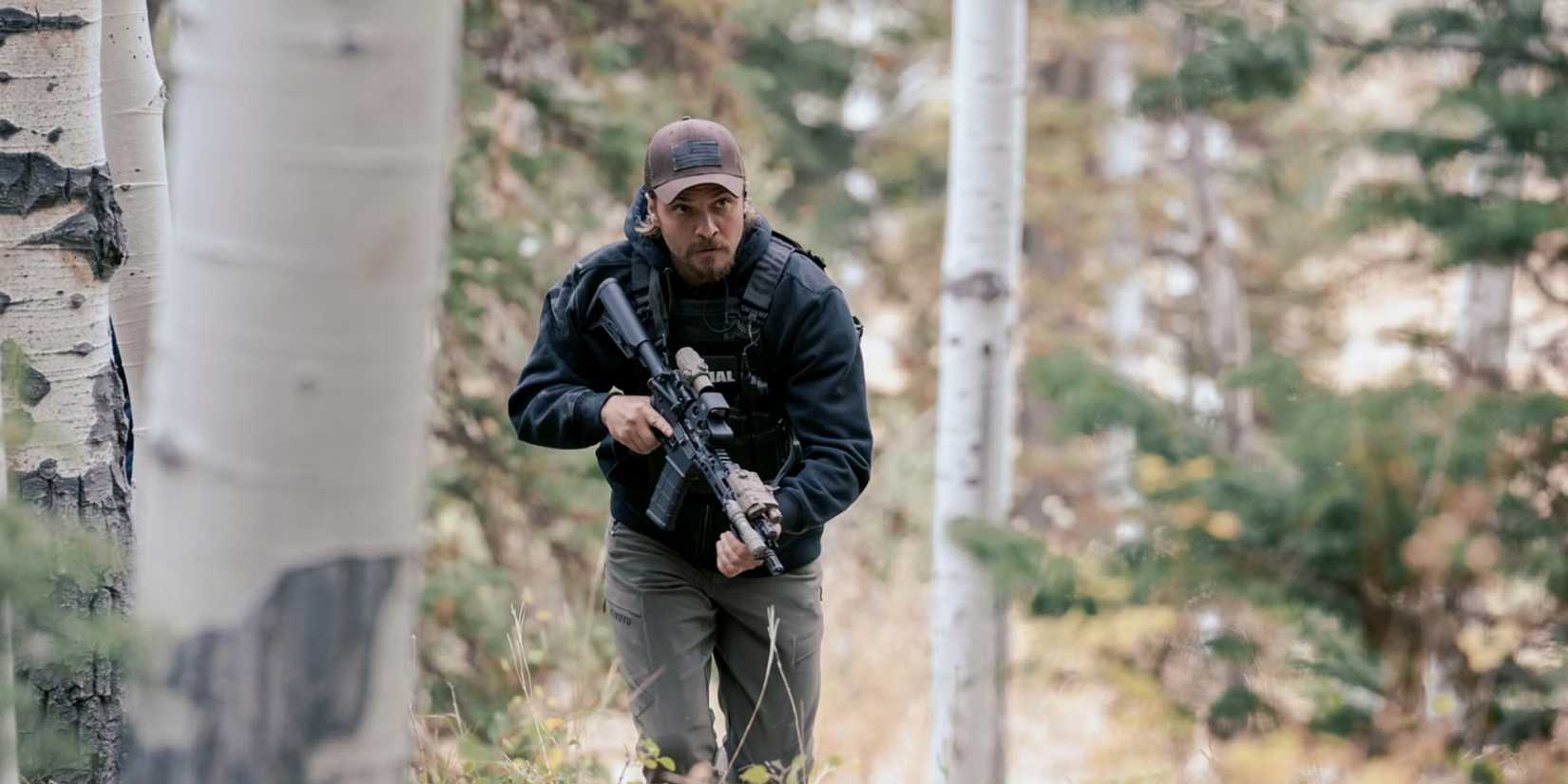 Kayce Dutton (Luke Grimes) wanders the forest with a firearm in the 'Marshals' episode "Road to Nowhere"