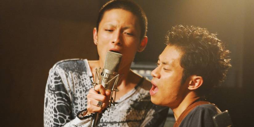 Men singing into a mic in 'Fish Story'