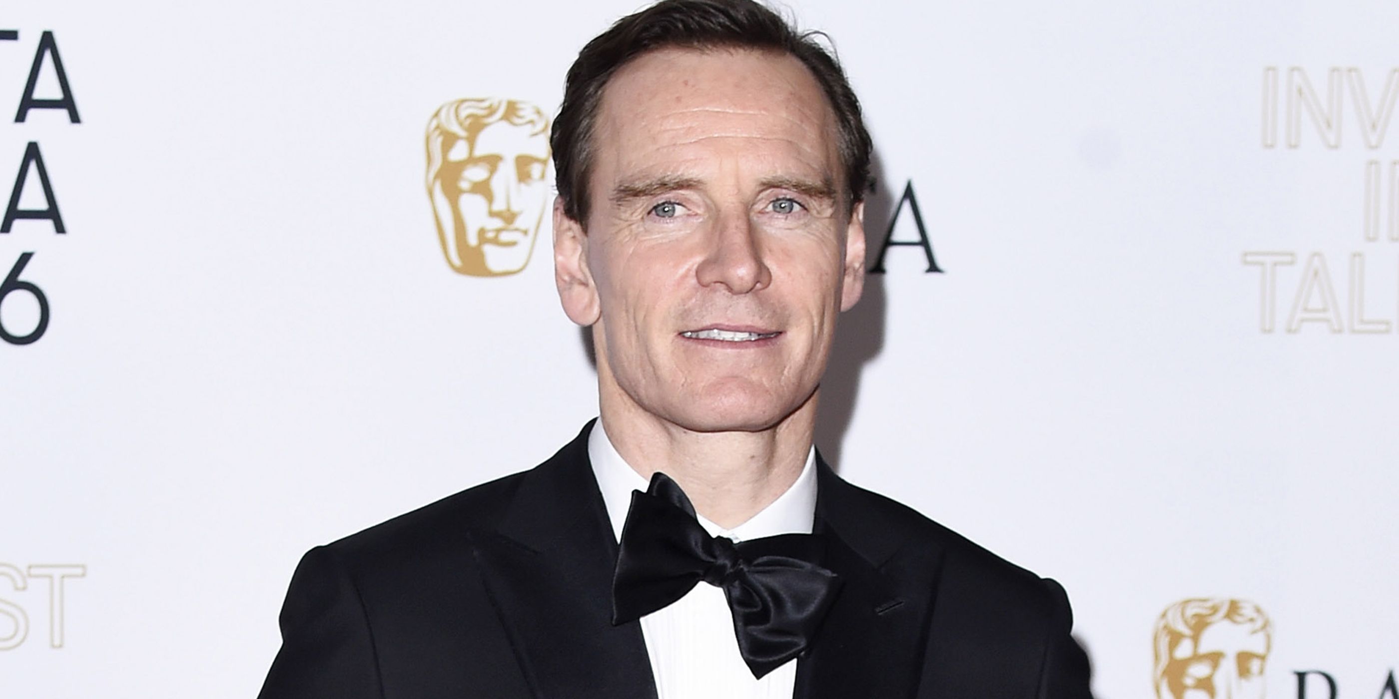 Michael Fassbender standing on the red carpet