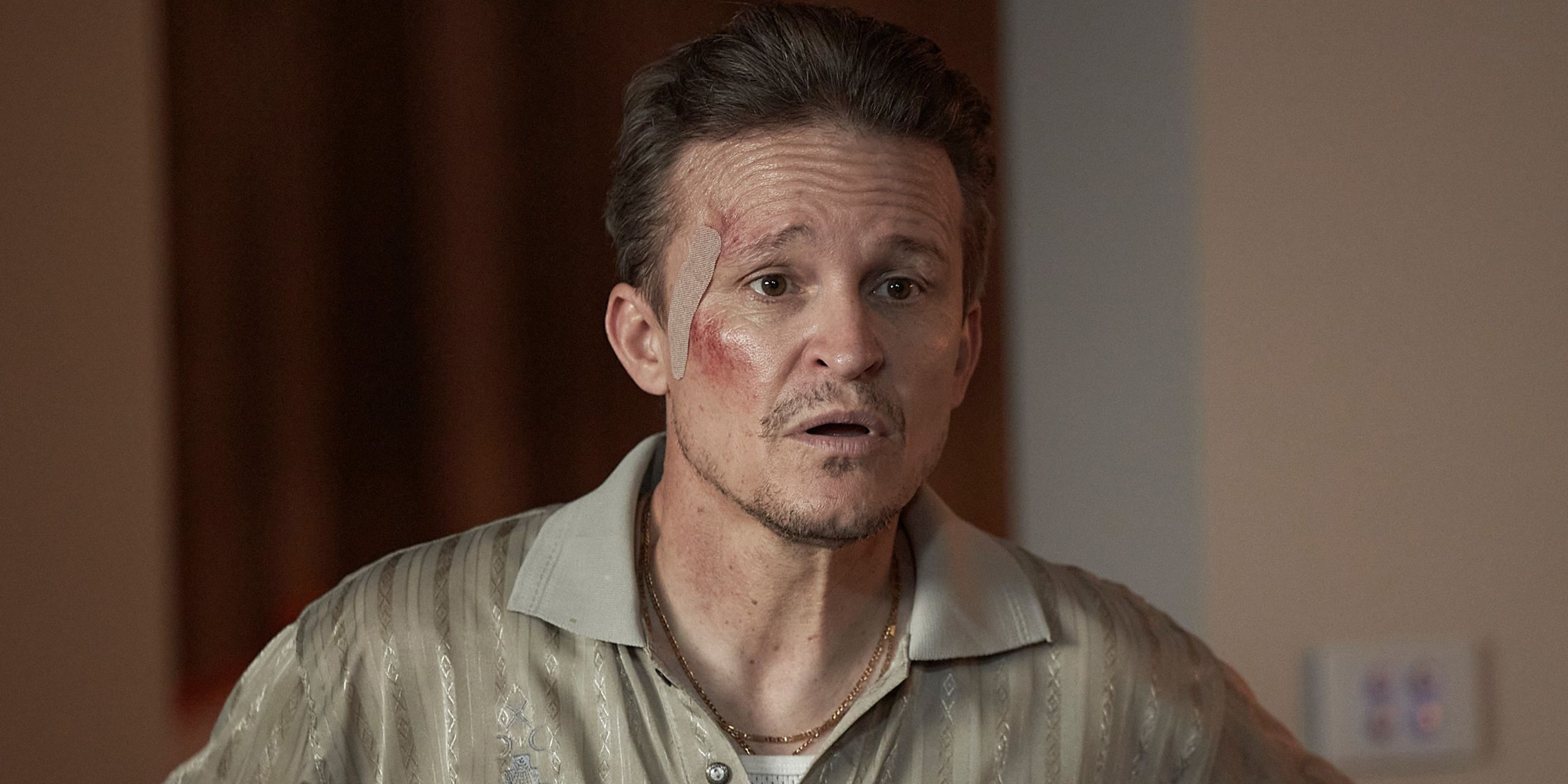 Damon Herriman bloodied and looking annoyed in Mr Inbetween