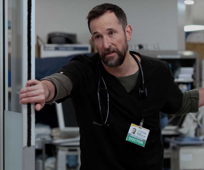 Dr. Robby (Noah Wyle) standing inside a door frame on 'The Pitt'