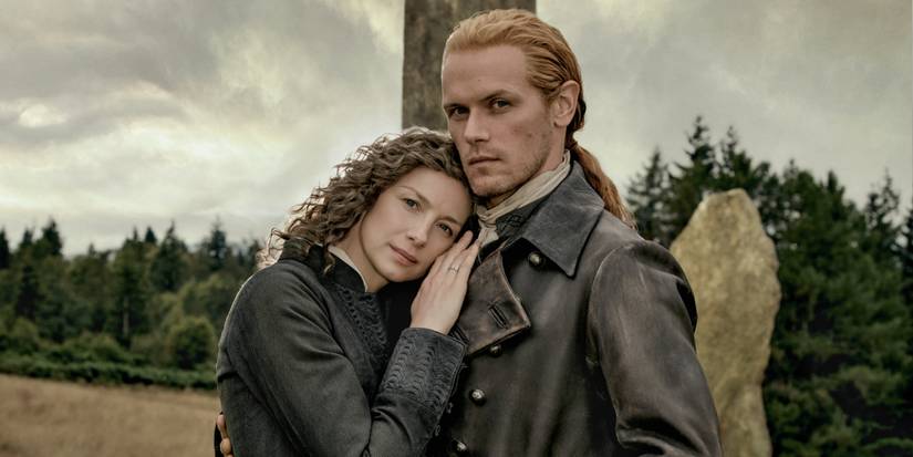 Caitriona Balfe as Claire leaning her head on the chest of Sam Heughan as Jamie in Outlander Season 8