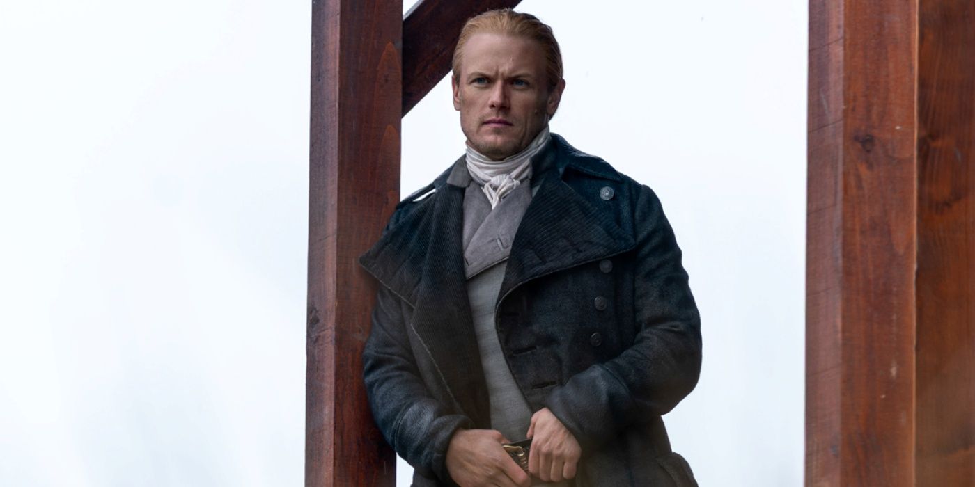 Sam Heughan as Jamie Fraser leaning on the porch beam at the Ridge in Outlander Season 8