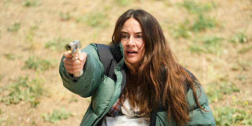 Annie aiming a gun offscreen in Paradise Season 2 Episode 4