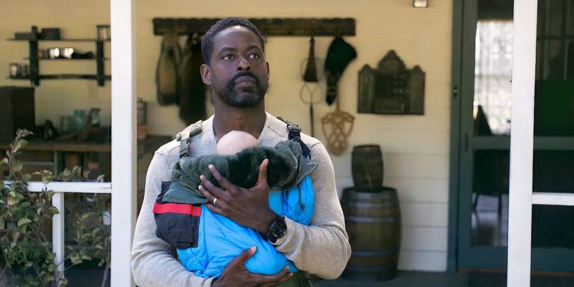 Xavier holding Annie's baby against his chest in Paradise Season 2 Episode 4