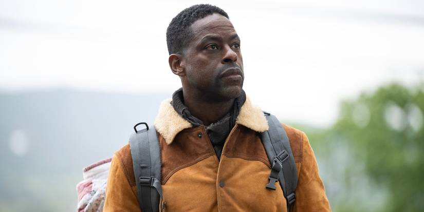 ستيرلنج ك. براون يمشي في الهواء الطلق حاملاً حقيبة ظهر في الجنة الموسم 2 الحلقة 4