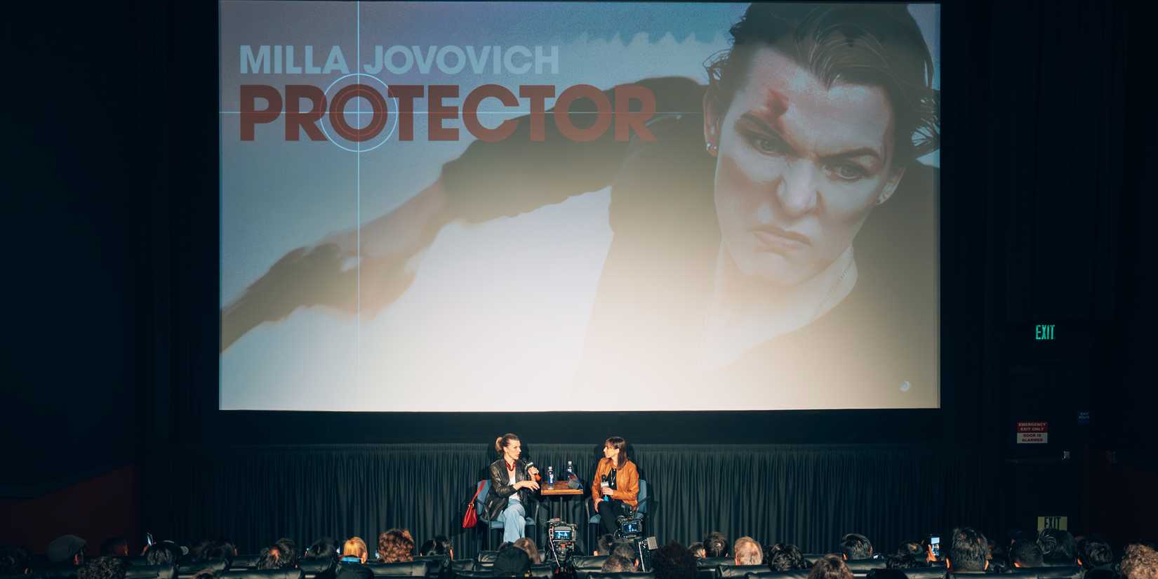 Milla Jovovich speaks on stage for Collider's Protector Q&A.