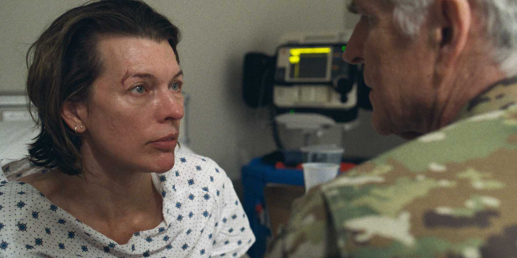 Nikki is in a hospital gown talking to Colonel Joseph Lavelle.