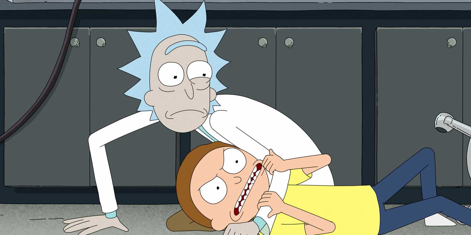 A worried Rick holding an angry Morty down in Rick and Morty Season 9