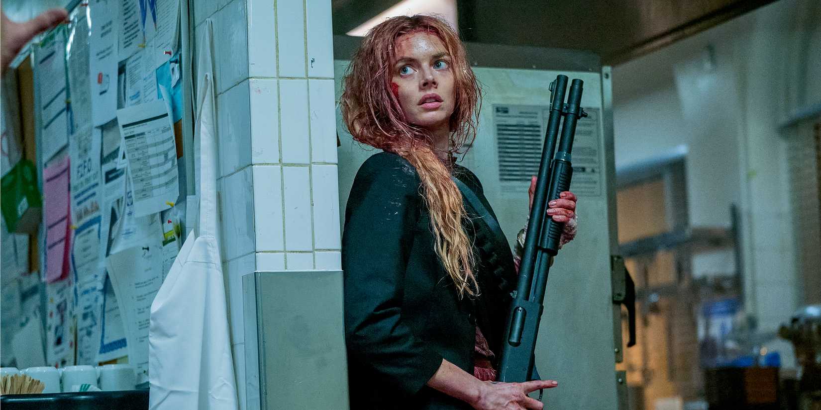 Grace hides with a gun, covered in blood.