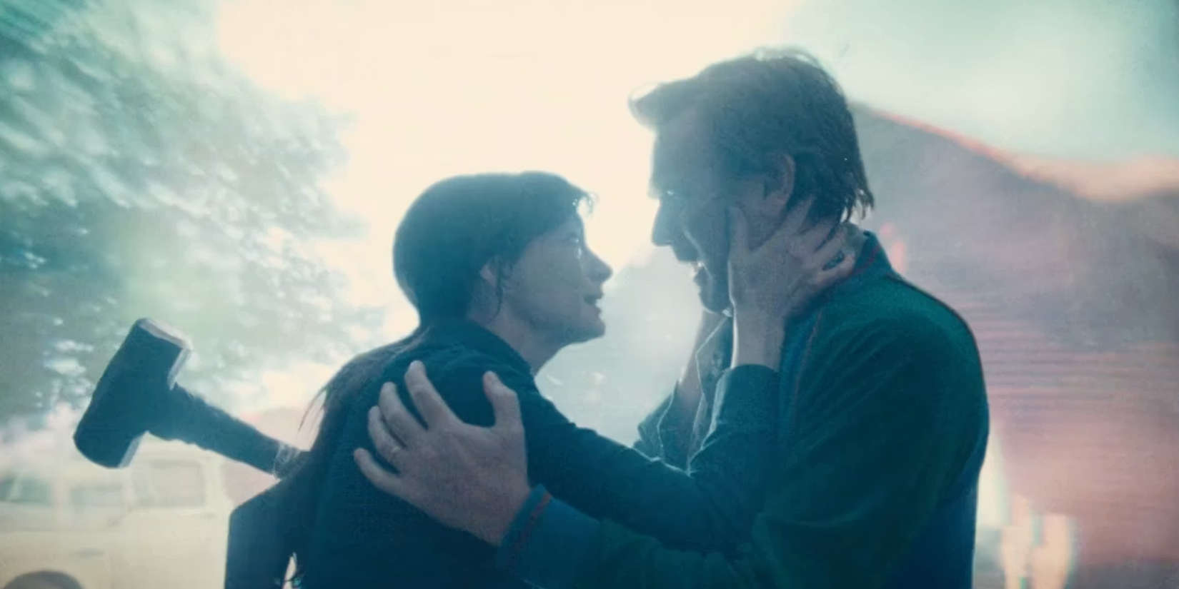 Ewan Mcgregor and Anne Hathaway hold each other in 'The End of Oak Street' 