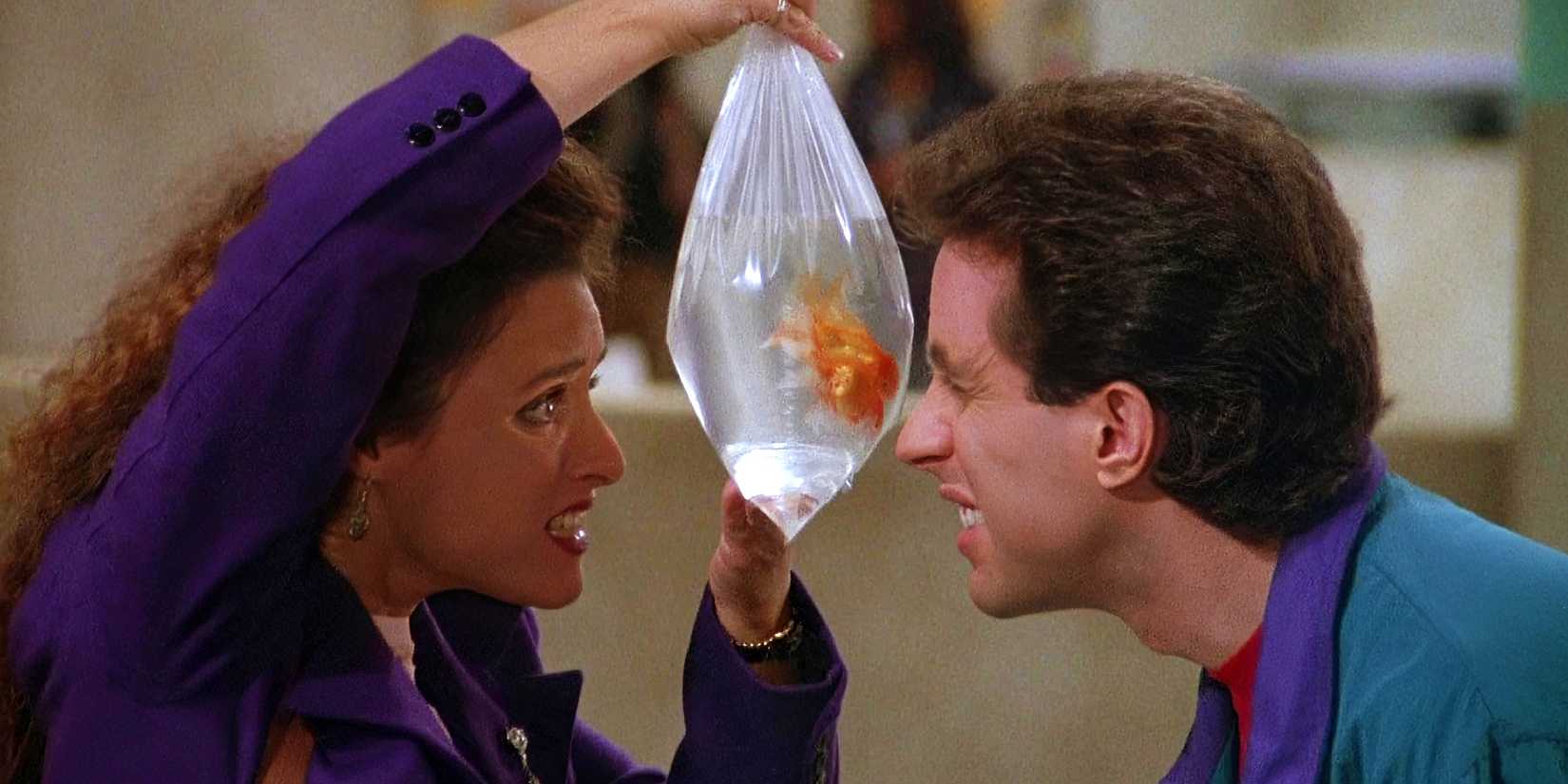 Julia Louis-Dreyfus's Elaine and Jerry Seinfeld's Jerry looking through a bag at a pet fish in Seinfeld's "The Parking Garage."