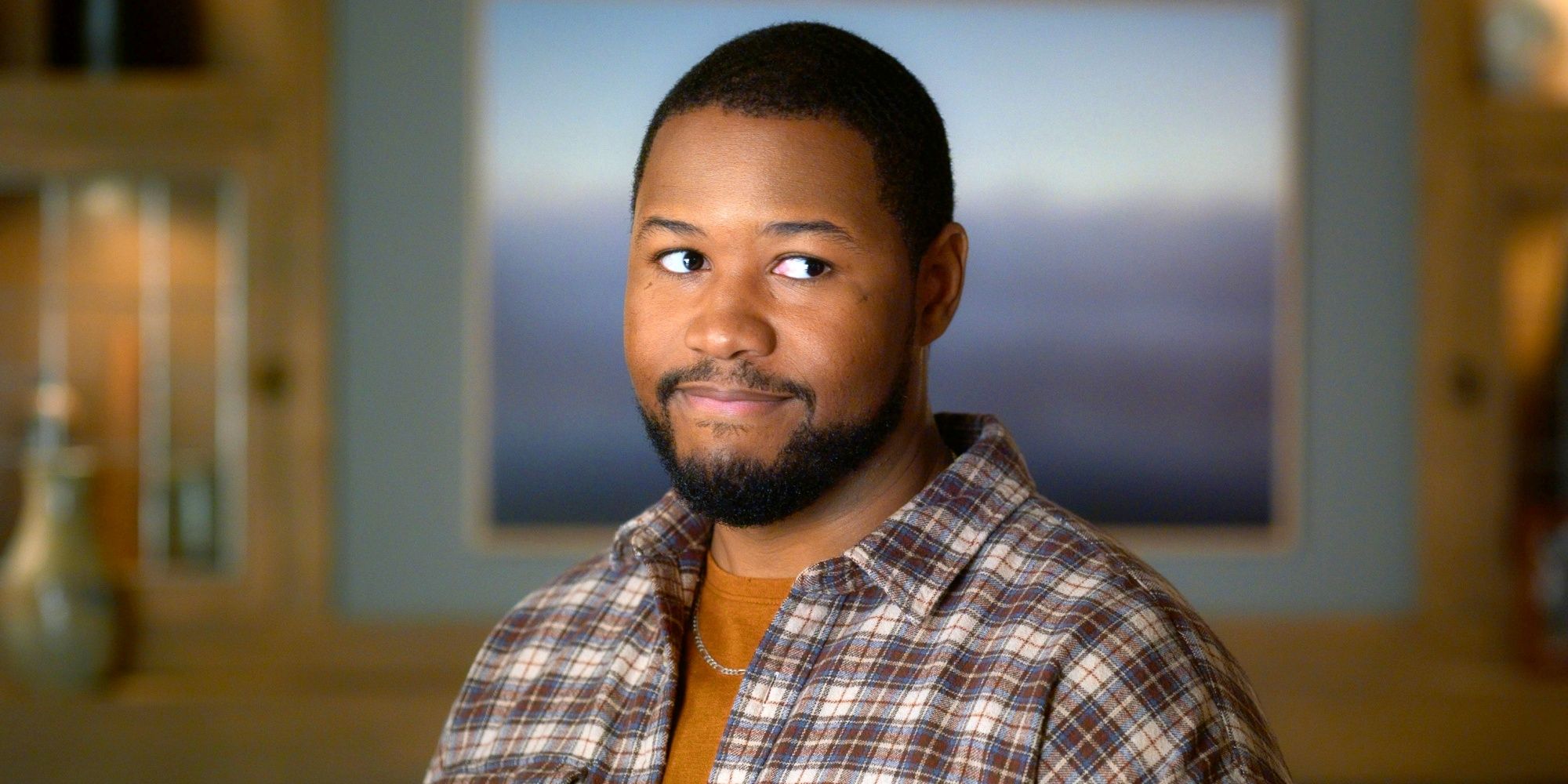 Luke Tennie as Sean giving a smirk and side eye in Shrinking Season 3