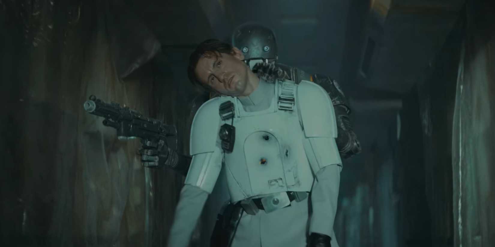 Supervisor Heert used as a shield by K-2SO in a dark hallway in Andor