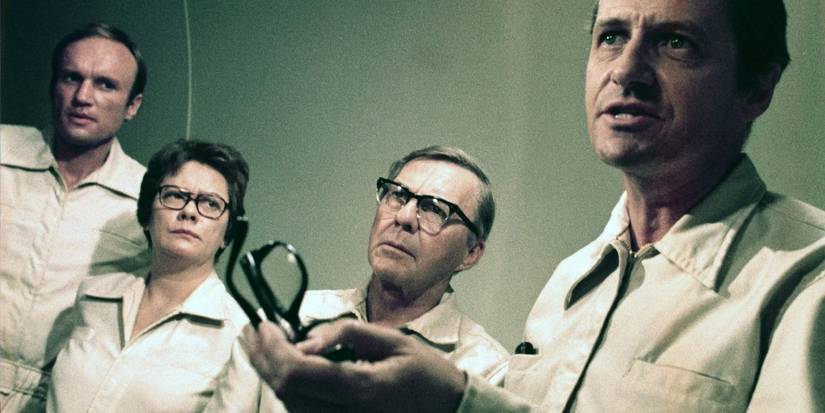 Cast of The Andromeda Strain standing together in a still from the movie