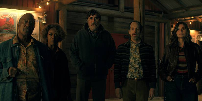 Five older people standing in the dark in The Boroughs.