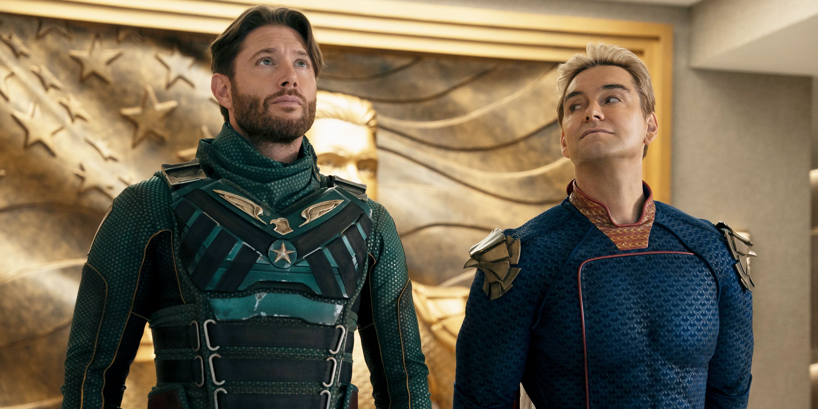 Homelander looks over at Soldier Boy as he looks up at something off-screen.