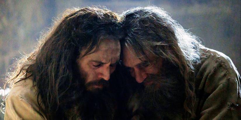 Edmond and Abbé Faria leaning their heads together in The Count of Monte Cristo