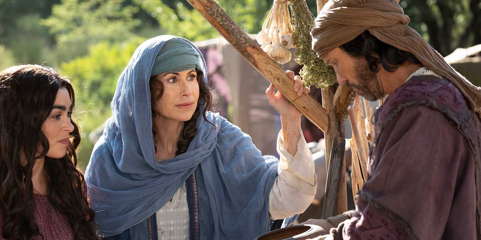Hagar (Natacha Karam) and Sarah (Minnie Driver) speak with Abraham (Jeffrey Donovan) in 'The Faithful: Women of the Bible'