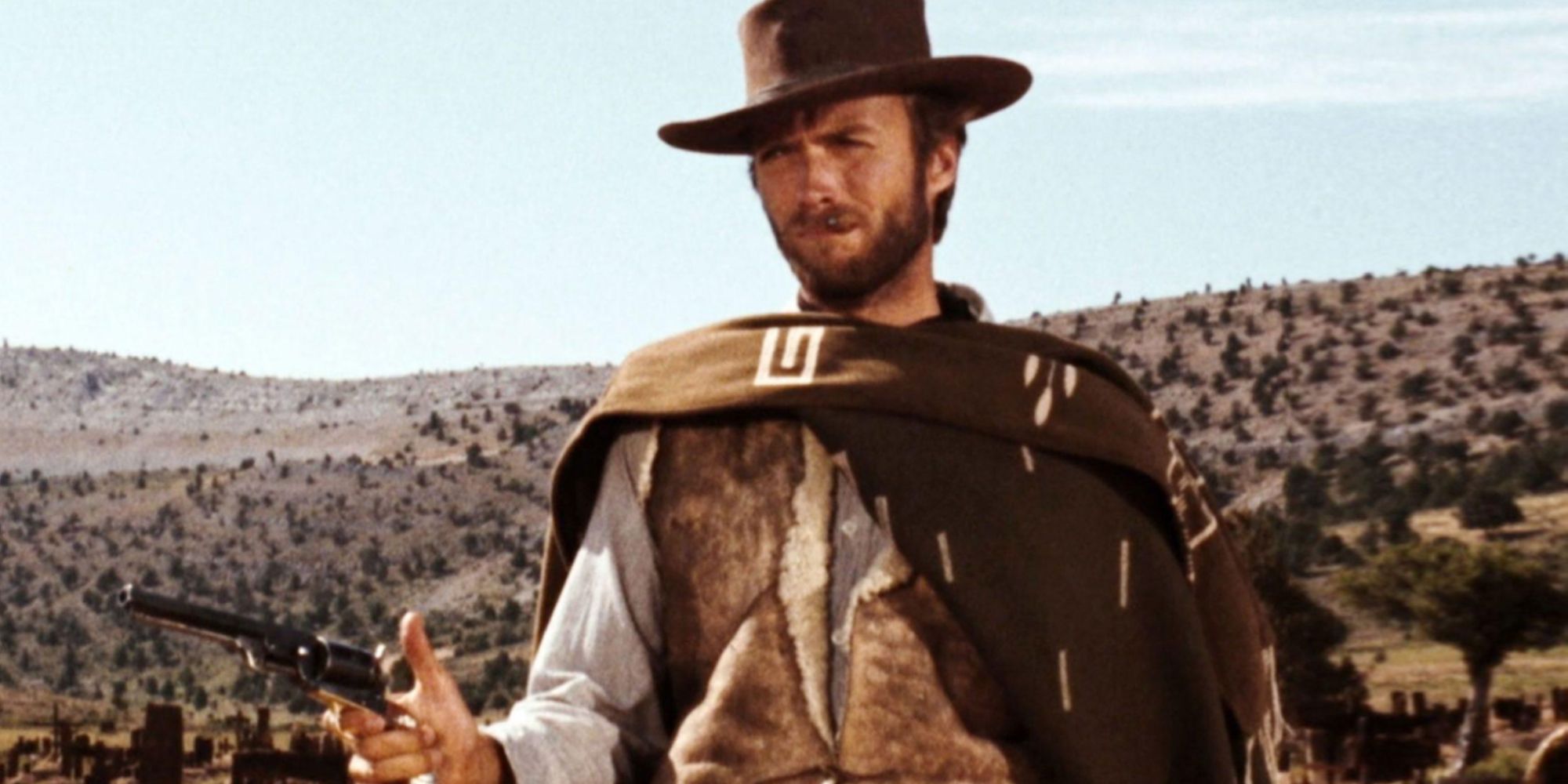 Clint Eastwood aiming his gun in the desert in The Good, the Bad and the Ugly