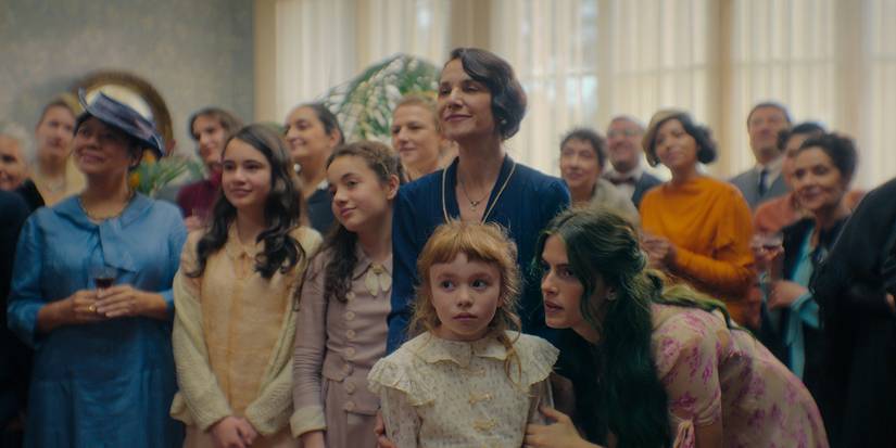 A big group of women standing together in The House of the Spirits.