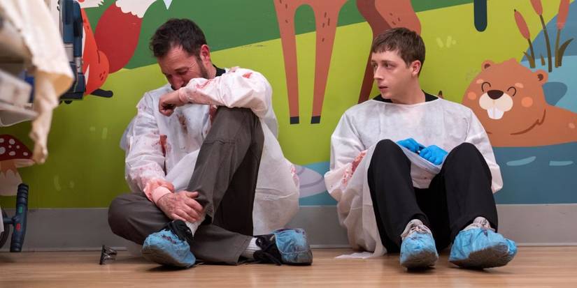 Dr. Robby crying while Whitaker sits next to him in 'The Pitt' Season 1.