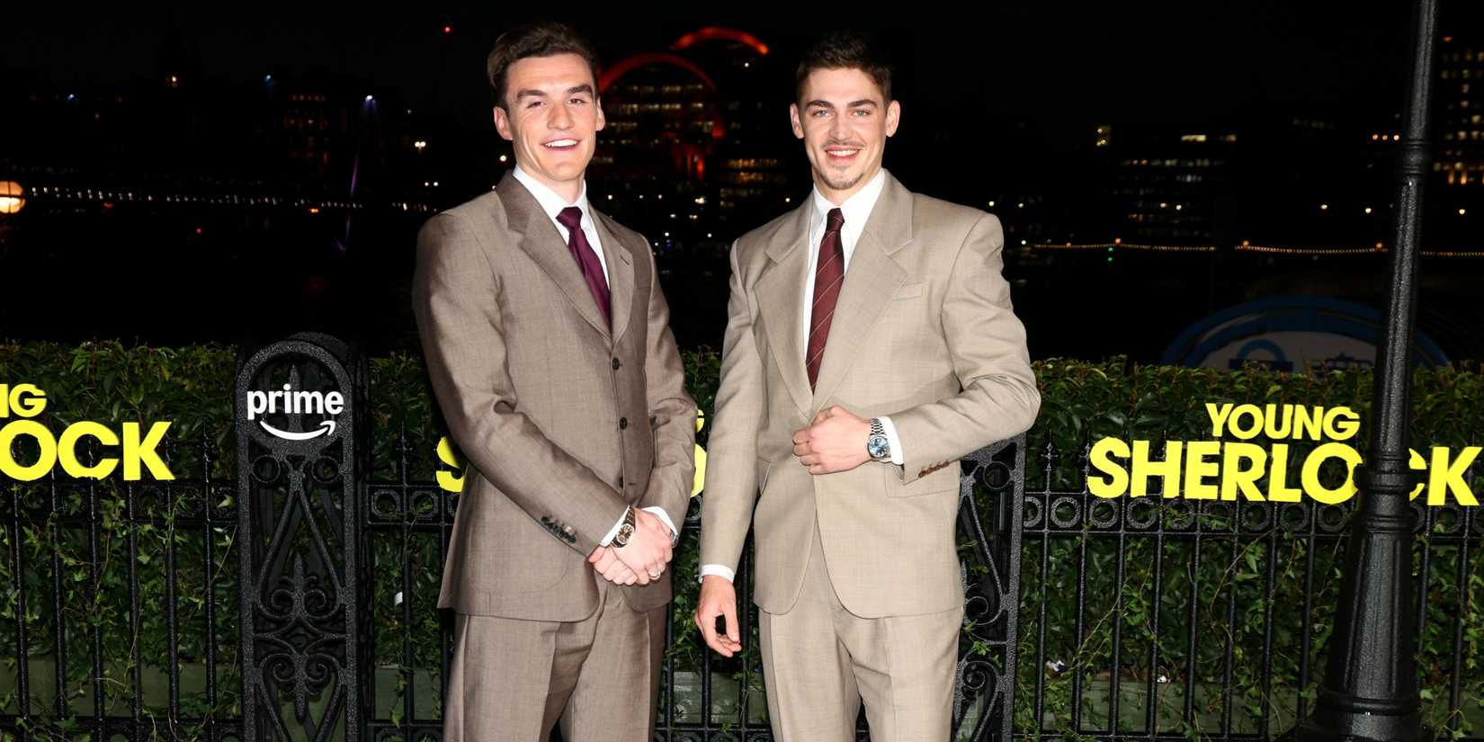 Dónal Finn smiling with Hero Fiennes Tiffin as they stand together at a special screening of Young Sherlock