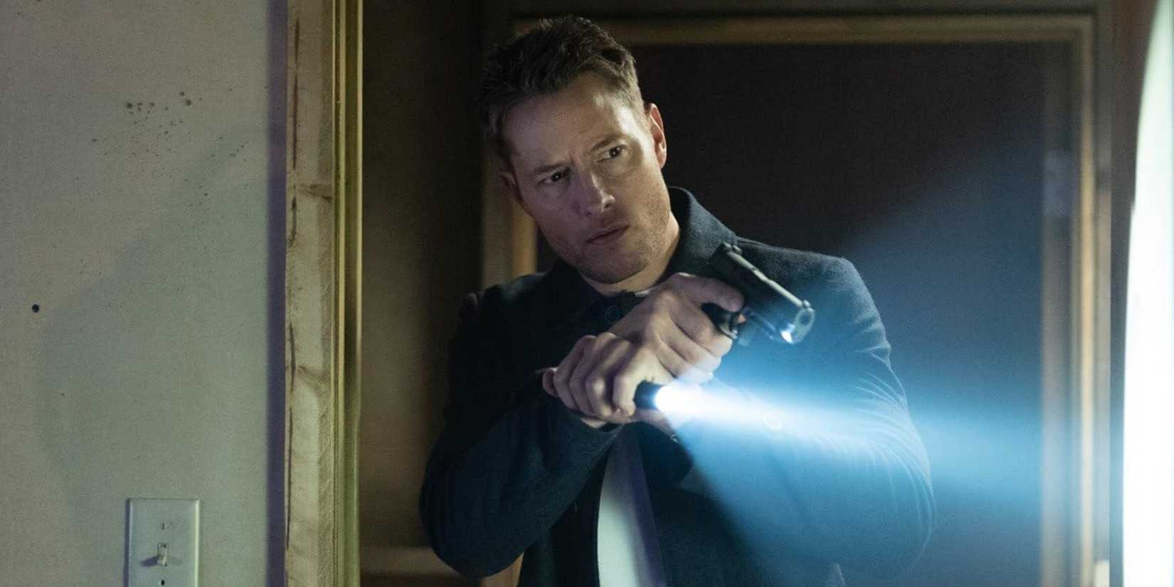 Justin Hartley as Colter Shaw on the case with a flashlight and a gun in the 'Tracker' episode "To the Bone"