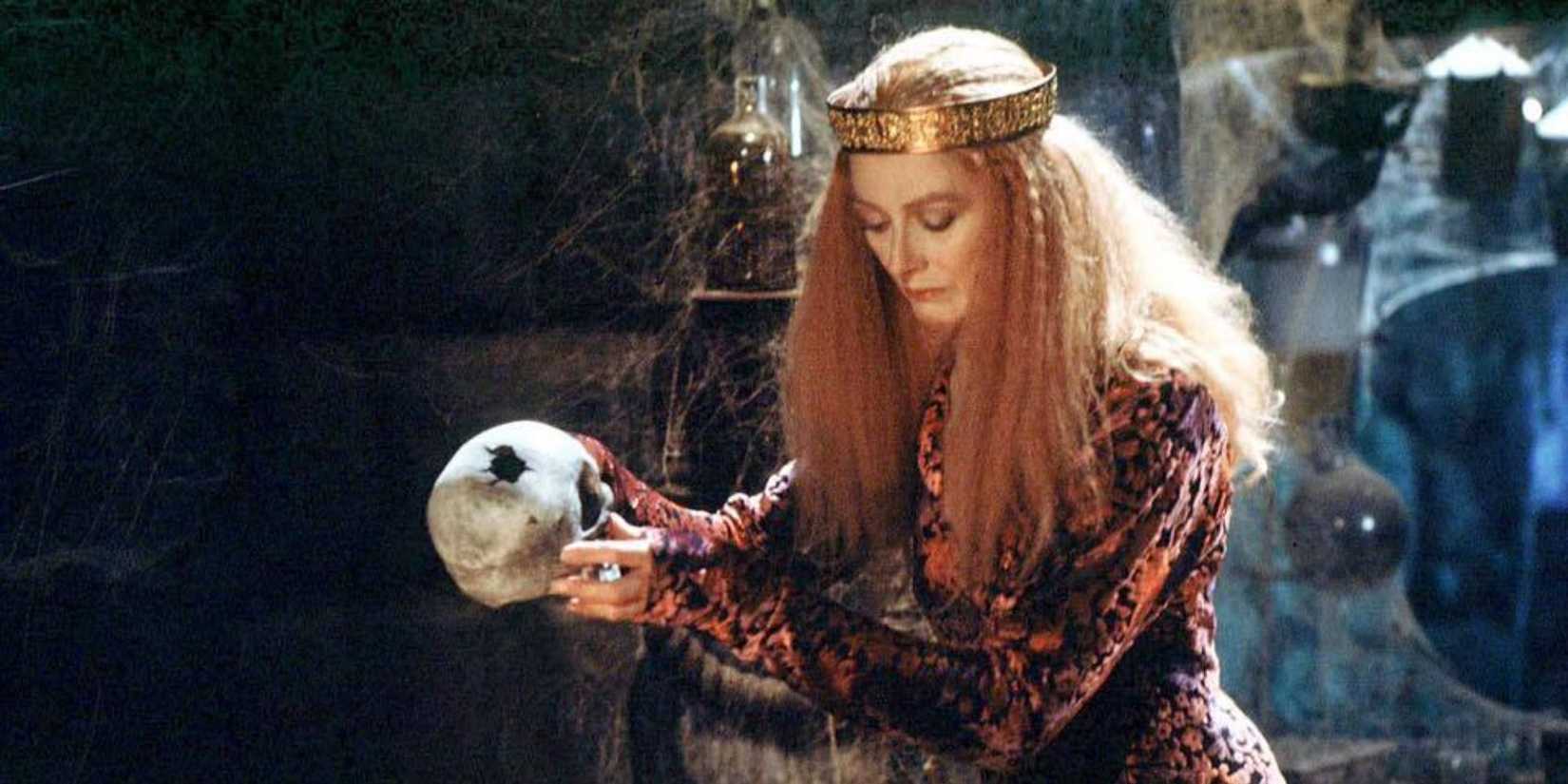 Vanessa Redgrave holds a human skull and looks down in the Snow White and the Seven Dwarfs episode of Faerie Tale Theatre