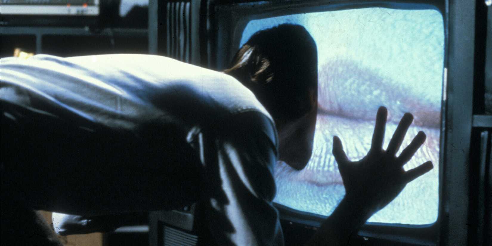 James Woods sticking his head on a TV in Videodrome (1983)