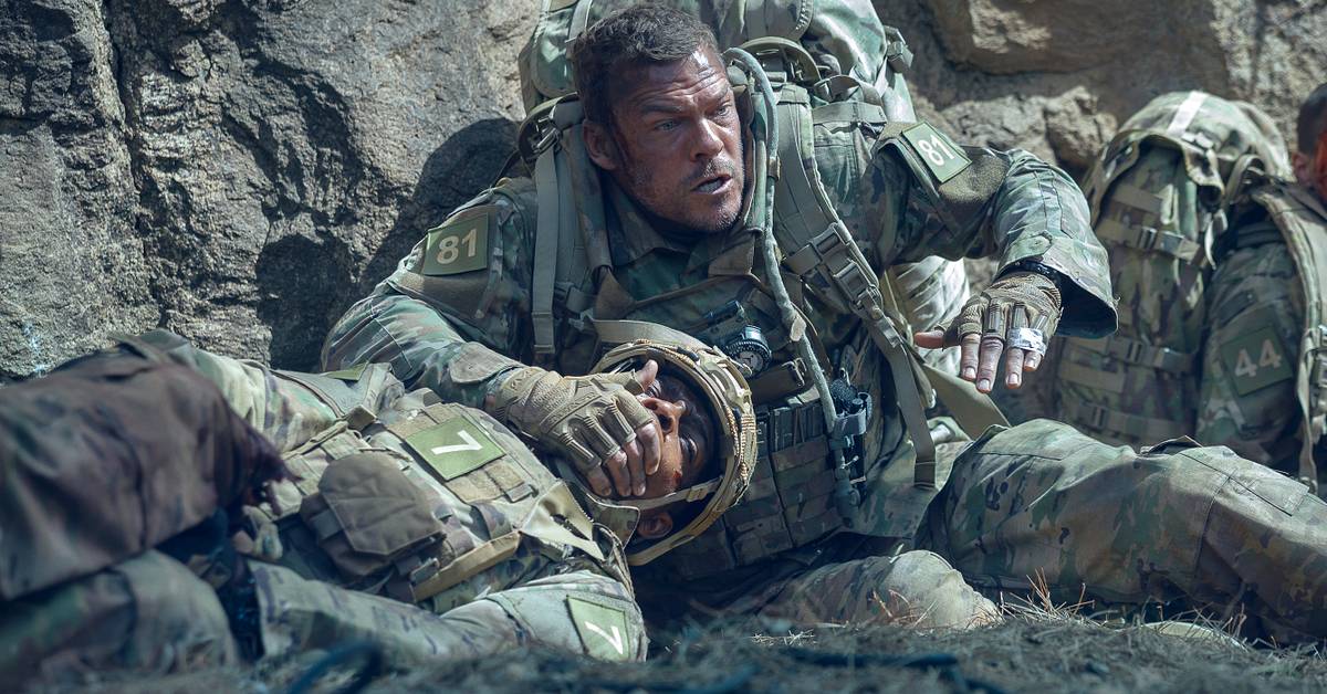 Alan Ritchson in action during a dramatic rescue scene in War Machine