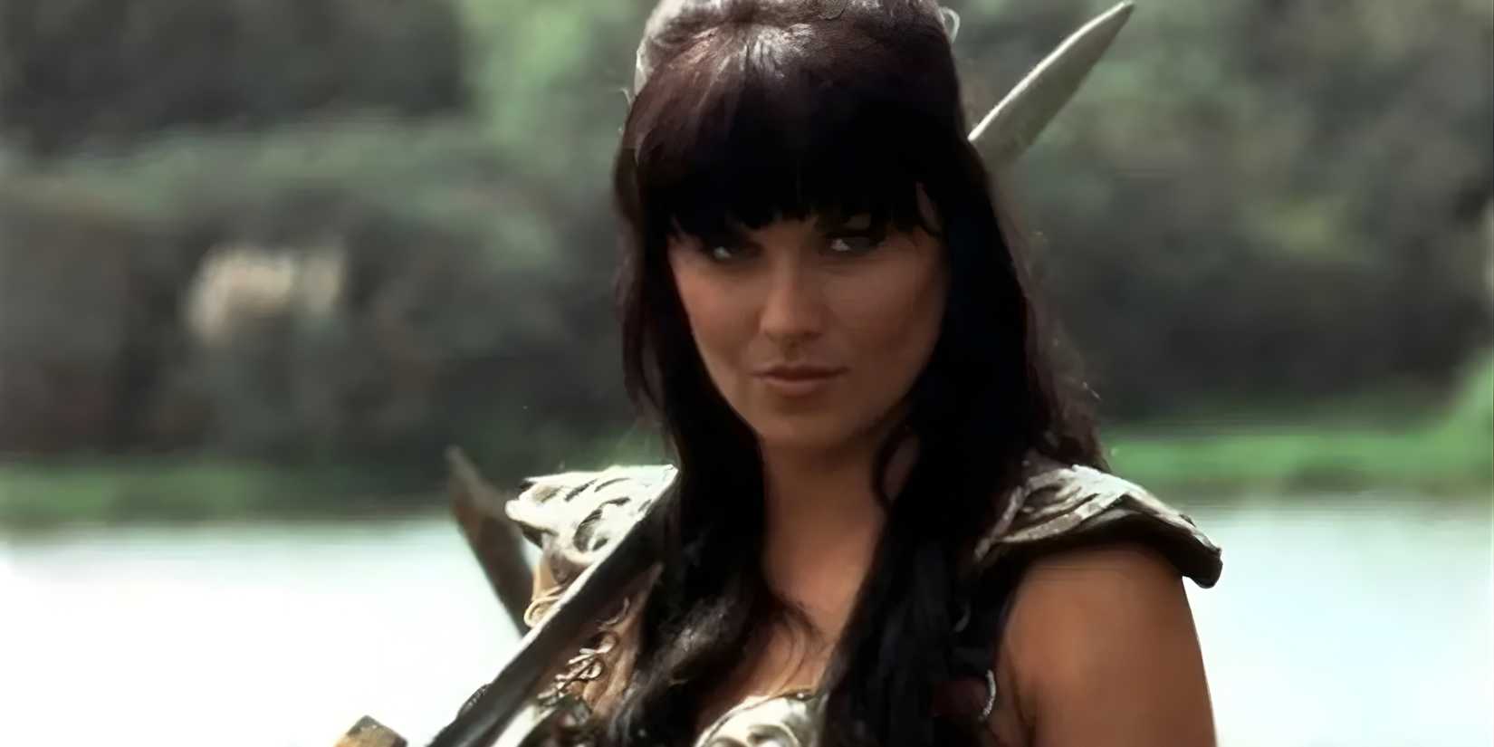 Xena (Lucy Lawless) brandishes a sword in Xena: Warrior Princess.