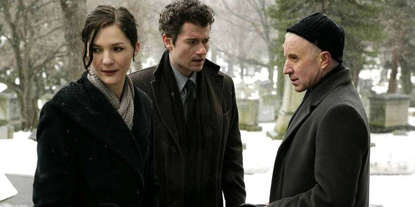 Three people standing together out in the snow in Rubicon