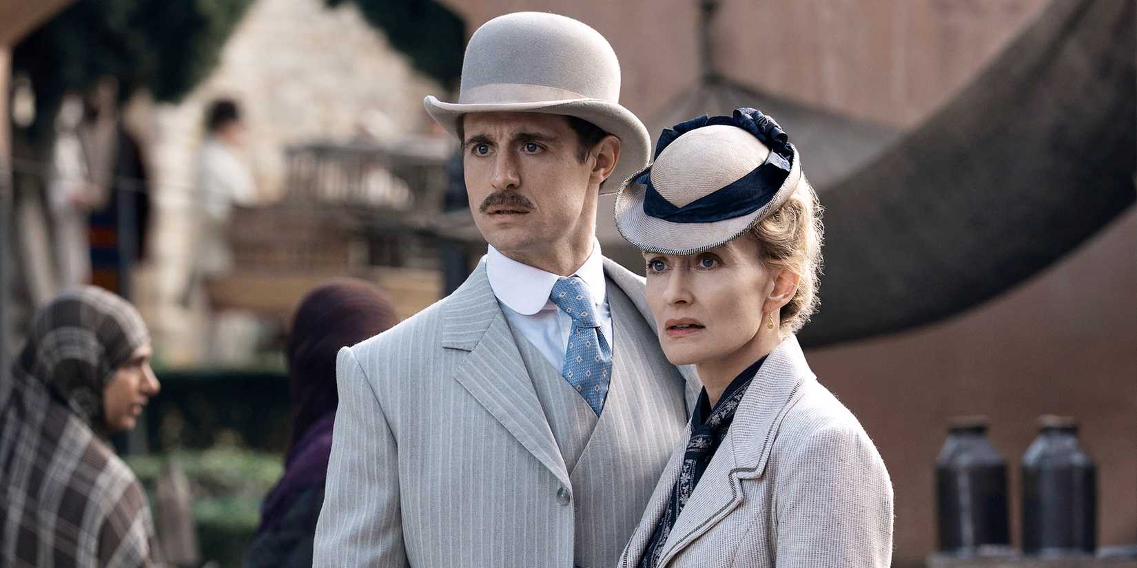 Max Irons as Mycroft Holmes standing outside with Natascha McElhone as his mother in Young Sherlock