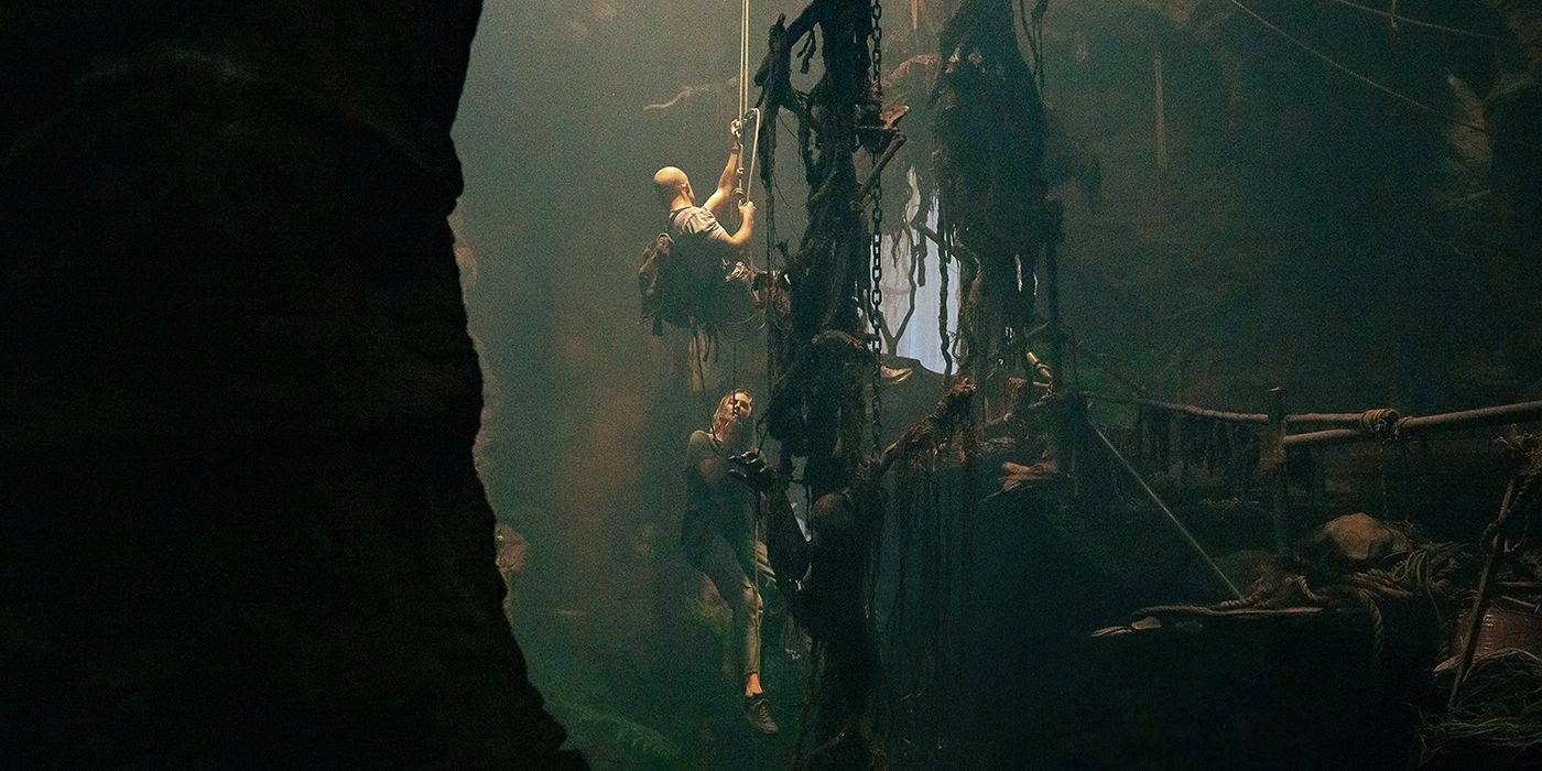 Taron Egerton and Charlize Theron going up the rope in Apex