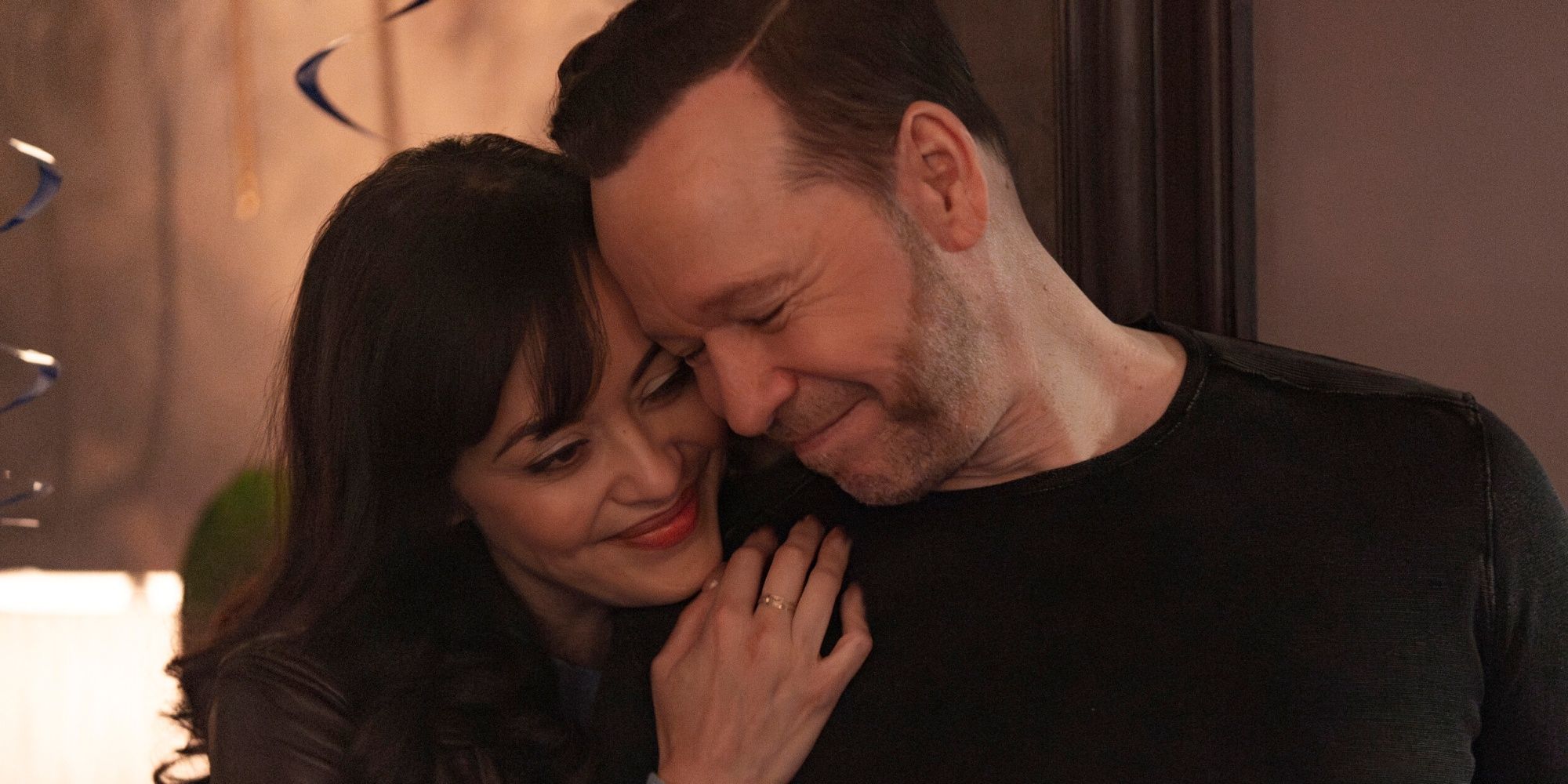 Donnie Wahlberg as Danny Reagan touching the forehead of Marisa Ramirez as Baez in Boston Blue Season 1