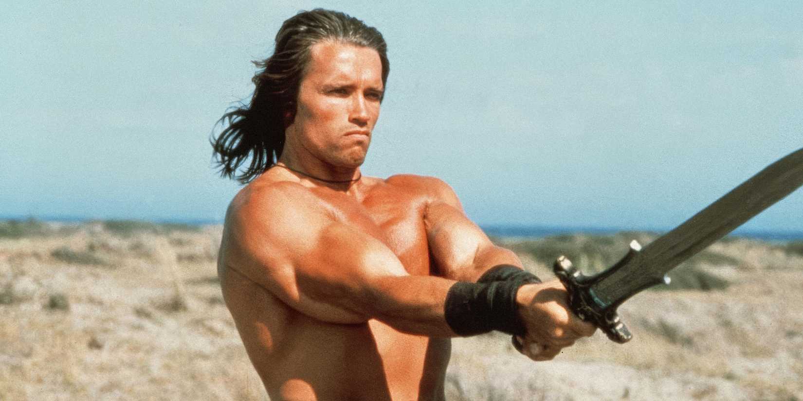 Arnold Schwarzenegger wielding a sword in Conan-the-Barbarian