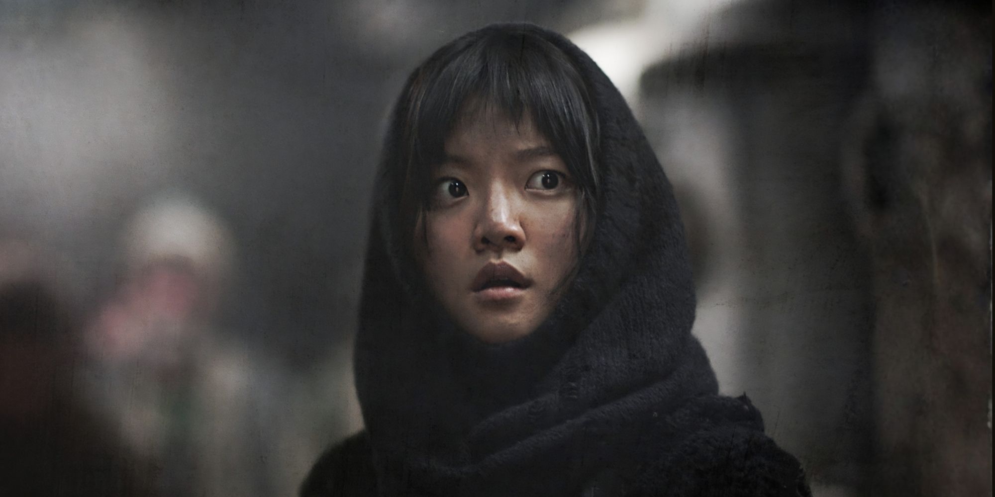 KO Ah-Sung looks worried on a train in Snowpiercer