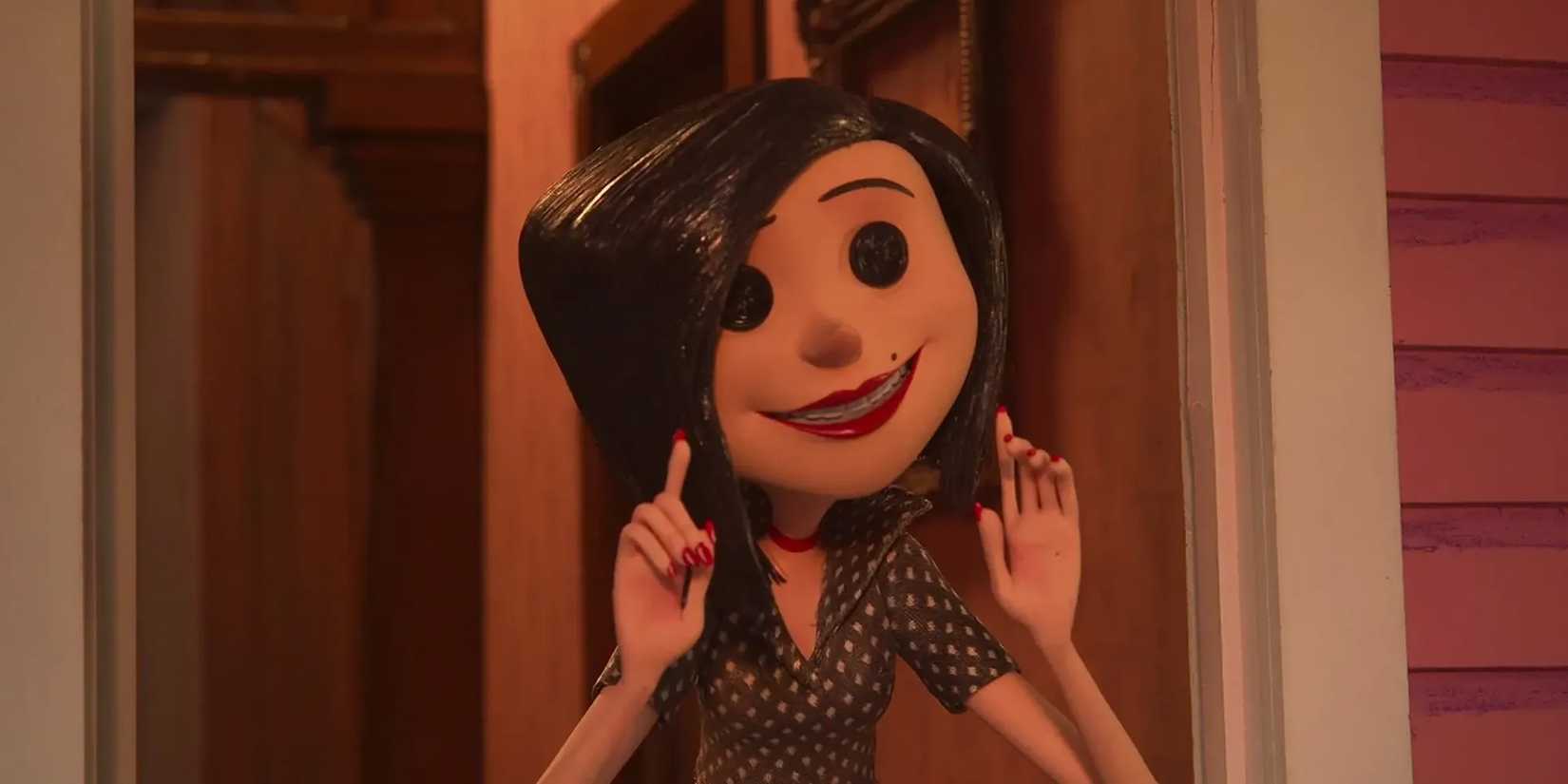 The Other Mother smiling threateningly at the Other Wybie in 'Coraline'